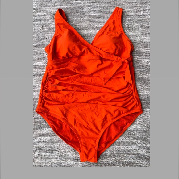 Orange One-piece swimming suit rushed sides with bow. - Picture 1 of 10